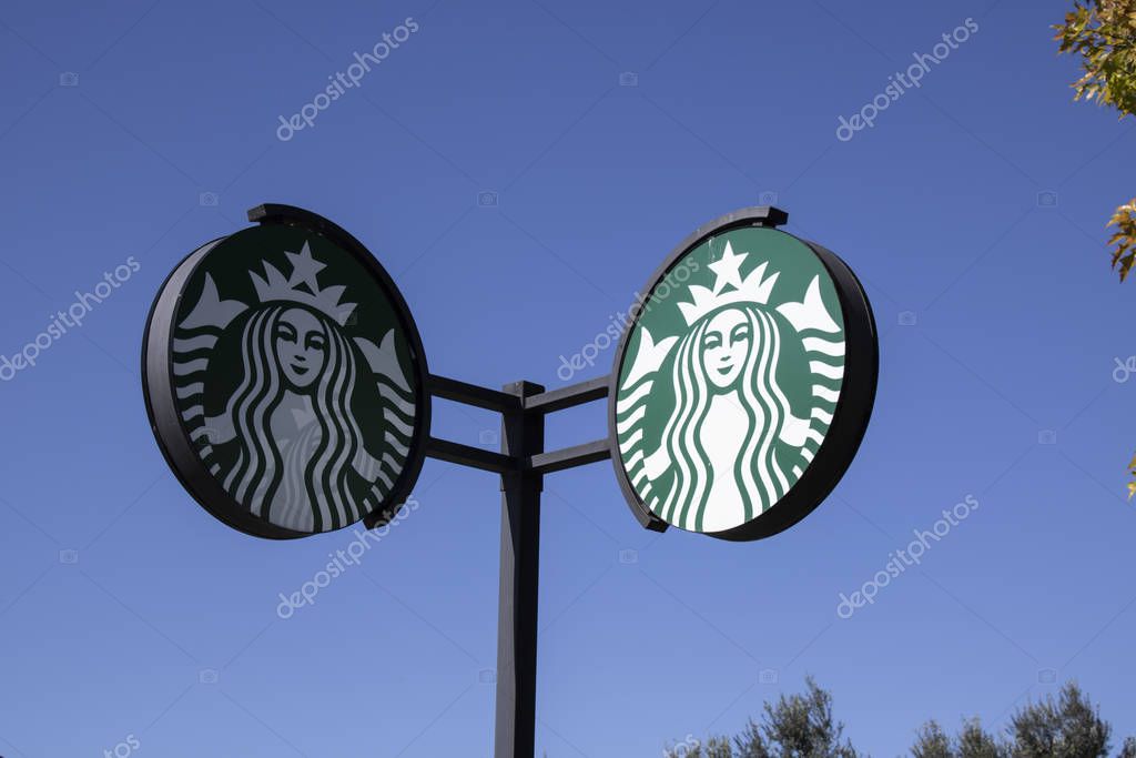 Istanbul, Turkey - October-13.2019: Starbucks sign at Starbucks Coffee Shop. Starbucks is an American global coffee company and coffeehouse chain sold around the world. Blue Sky