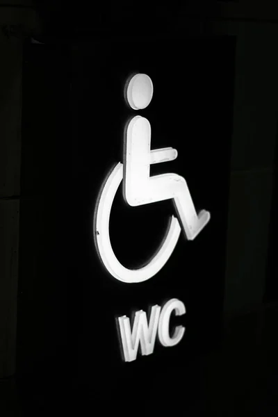 Disabled toilet sign close-up. Angled photographed. With black and white colors. Close up — 스톡 사진