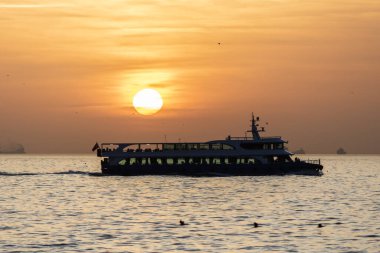 Kadikoy Moda coast sea view at sunset. Photographed outdoors. Golden hour