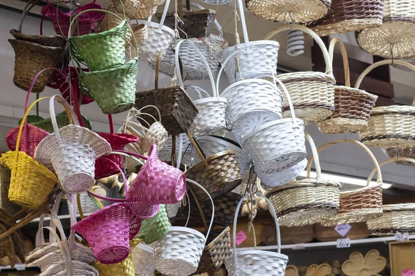 Beautiful jute baskets of different colours for sale at a shop in Turkey.
