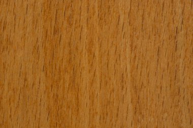 Tahta açık kahverengi makro shot. Yüzeyde karanlık dikey çizgiler var..