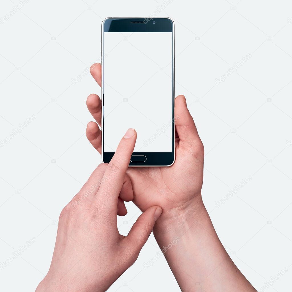 Female hands holding a smartphone on white background, index finger taps on screen