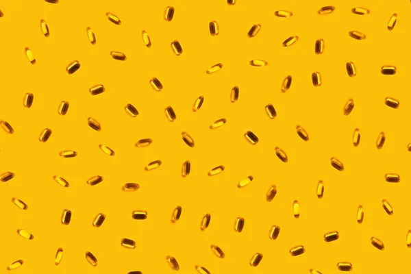 Pills omega 3 on a yellow background. — ストック写真