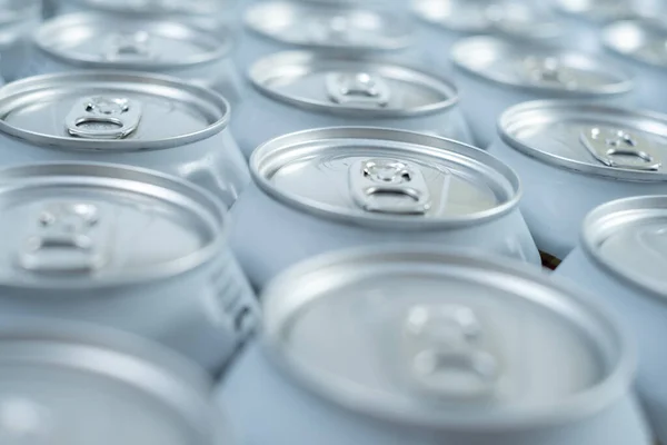 aluminum color grouped soda cans on white background