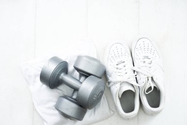 Fitness tracking concept. Running shoes flat lay view.