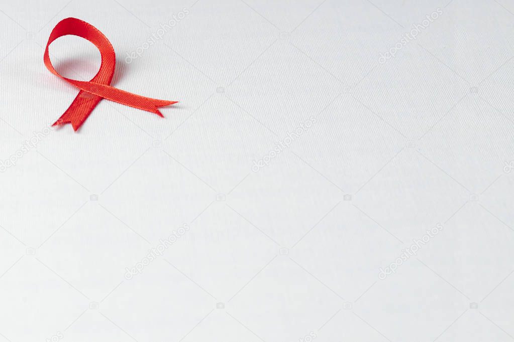 Aids red ribbon support for World aids day and national HIV/AIDS and aging awareness month concept