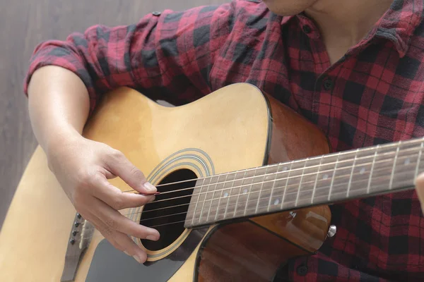 Acoustic Guitar Playing. Men Playing Acoustic Guitar Closeup Photography.