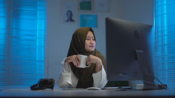 Sleepy Asian Muslims Wearing Dark Headscarves Drinking Coffee Working Home — Stock Video