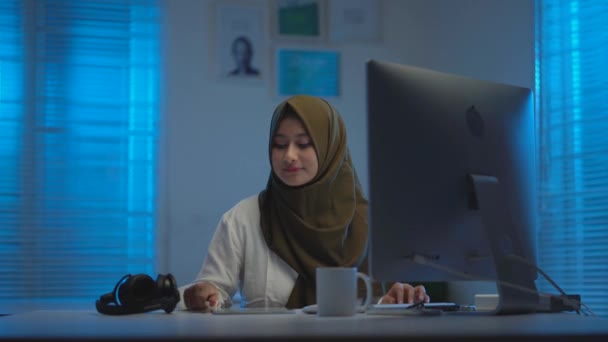 Sleepy Asian Muslims Wearing Dark Headscarves Drinking Coffee Working Home — Stock Video