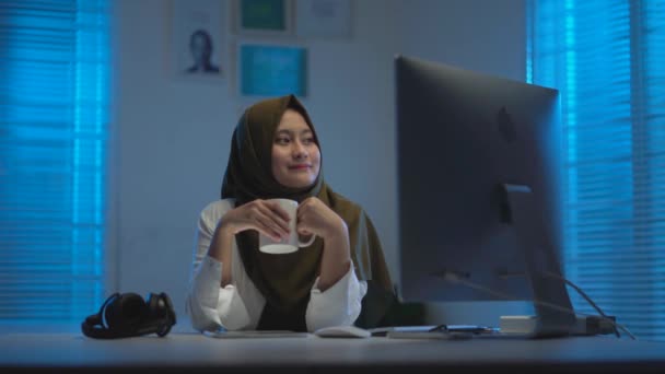 Sleepy Asian Muslims Wearing Dark Headscarves Drinking Coffee Working Home — Stock Video