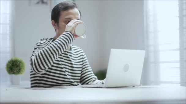 Casual Asian Young Man Drinking Cup Coffee Working Home His — Stock Video