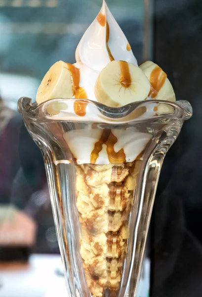 Japanese icecream with banana, vanilla cream and caramel sauce.