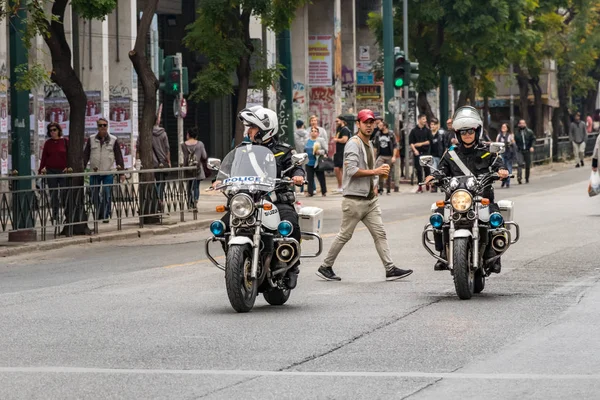 Two Greek police officers on motorcycle at 28th Oktovriou st closing the road. — Stock Photo, Image