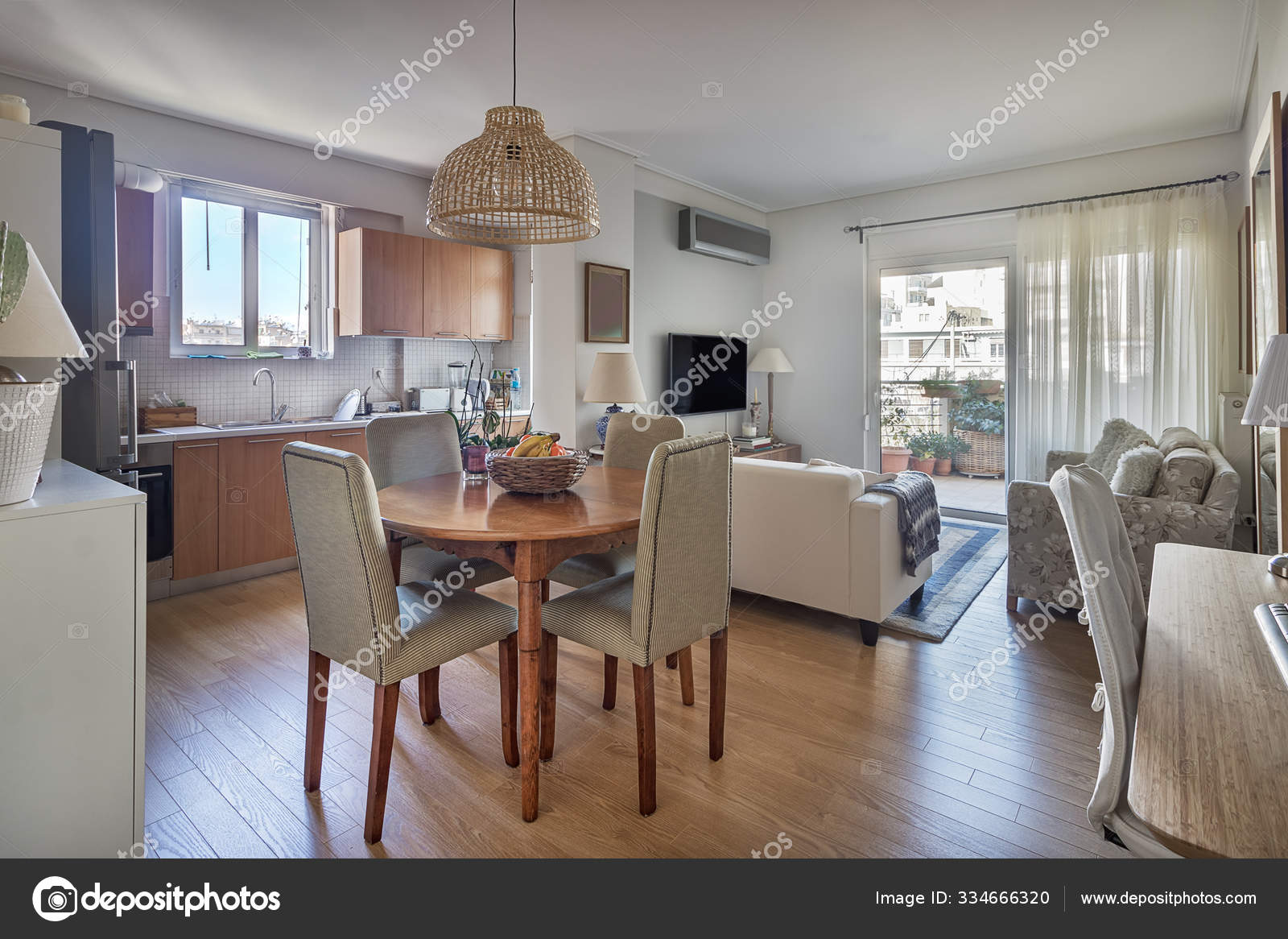 Open-Concept Of A Kitchen, Dining Wooden Table And Living Room. Stock Photo  By ©Ruramos 334666320