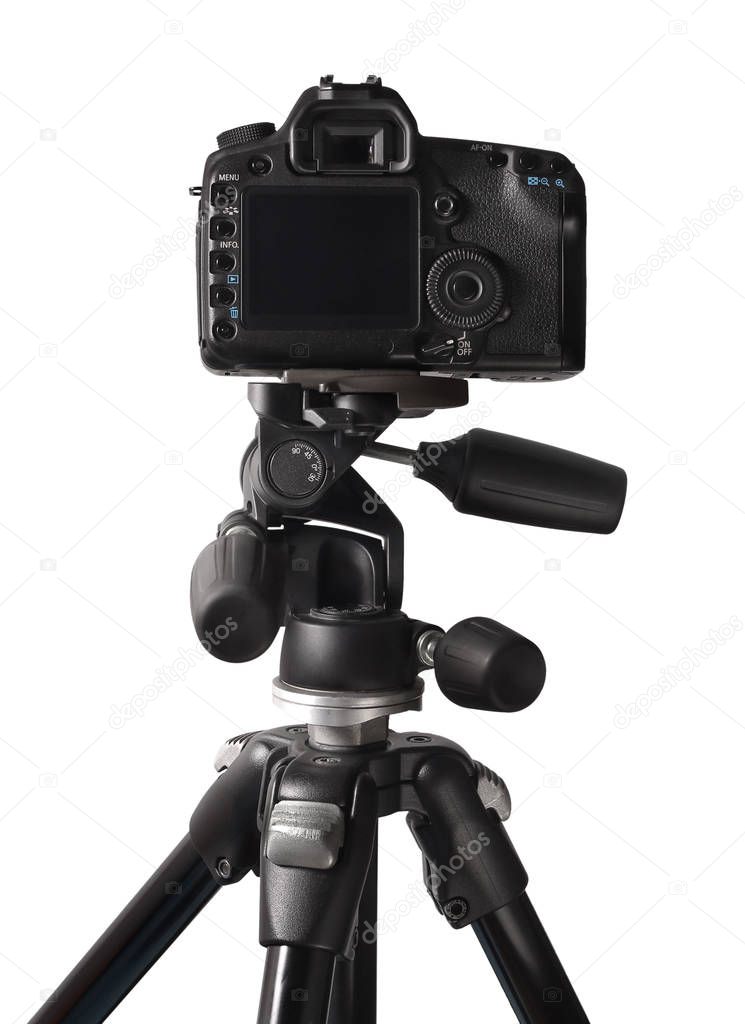 Image of DSLR camera on tripod isolated over white background
