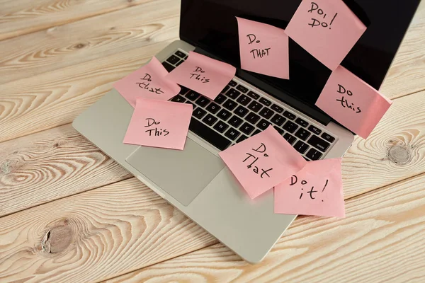 Image of laptop full of sticky notes reminders on screen. Work overload concept image. Coworking or working at home concept image.