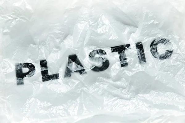 Siyah Plastik Kelime Saydam Beyaz Plastik Torba Üzerinde Kopya Alanı — Stok fotoğraf