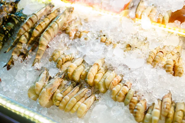 Fresh seafood in the freezer with ice in the night Thailand mark — Stock Photo, Image
