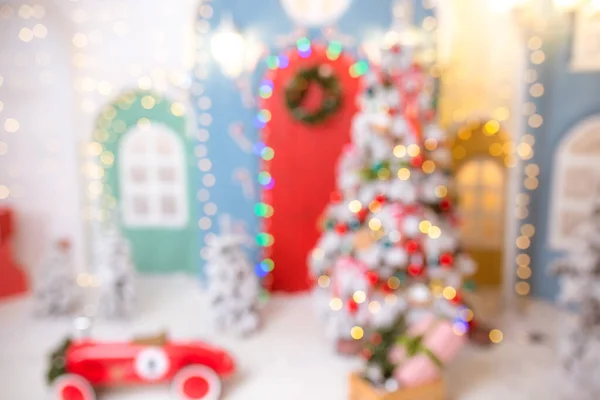 Kerst achtergrond met feestelijke bokeh verlichting, wazig vakantie achtergrond — Stockfoto