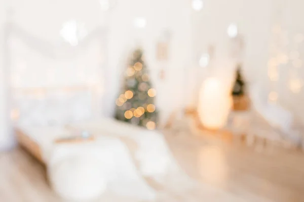 Beautiful holiday decorated room with Christmas tree and bright lights , out of focus shot for photo background. Blur christmas background