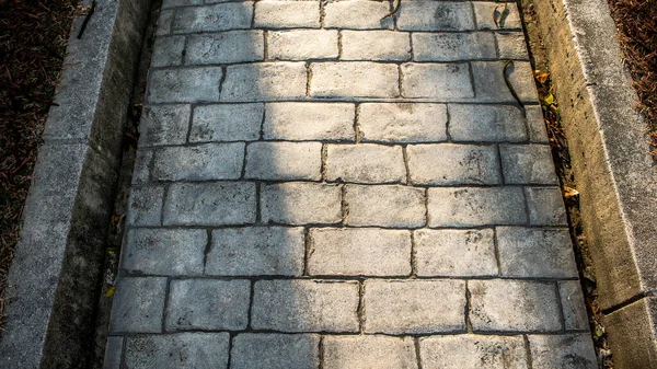 Vista superior sobre pavimento camino de piedra. Antiguo pavimento de empedrado cuadrado acera . —  Fotos de Stock