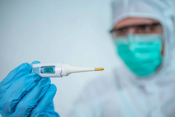 Closeup Man Wearing Protective Suit Surgical Mask Looking Thermometer Male — Stock Photo, Image