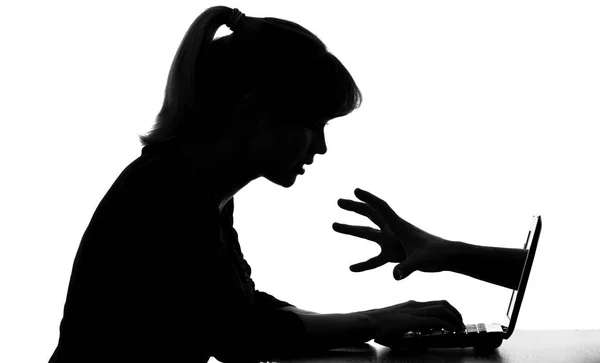 Silhouette of woman at a computer shows its hidden dangers for teens in Internet — Stock Photo, Image