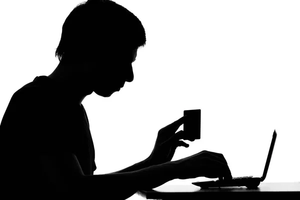 Portrait of a man shopping online with a credit card — Stock Photo, Image