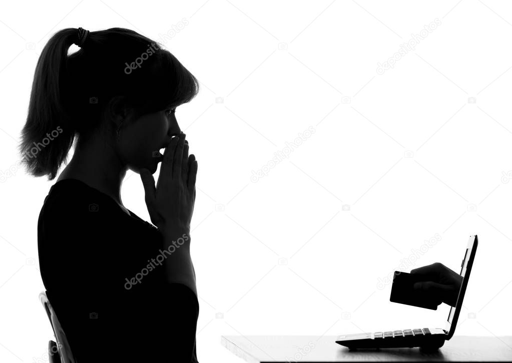 black and white silhouette of a woman shows the danger of online shopping by card