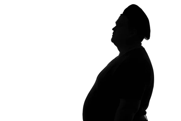 Silhouette di un uomo grassoccio in un berretto — Foto Stock