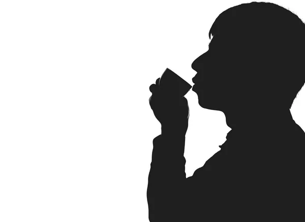 Silhouet van een man die koffie drinken — Stockfoto