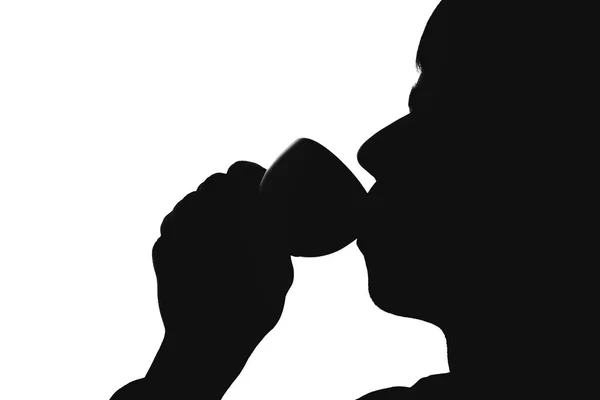 Silhouet van een man die koffie drinken — Stockfoto