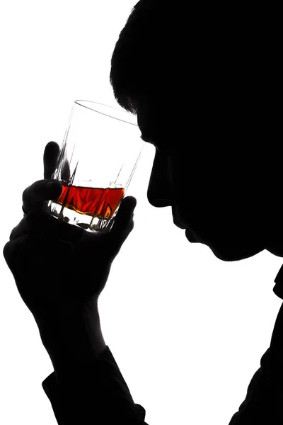 Silhouette of man in depression with alcohol drink — Stock Photo, Image