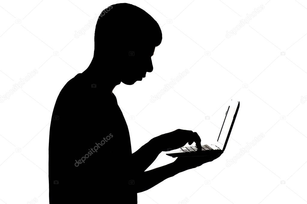 man with a hacking a password to the system on laptop