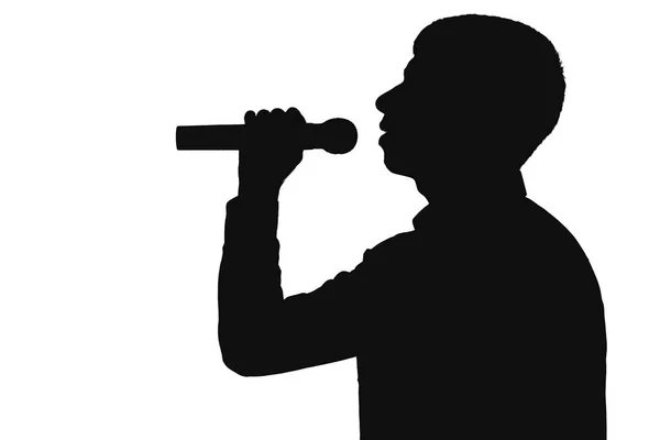 Profil de silhouette d'un homme chantant dans un microphone — Photo