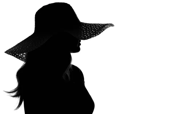 Silhouette d'une femme dans un chapeau — Photo