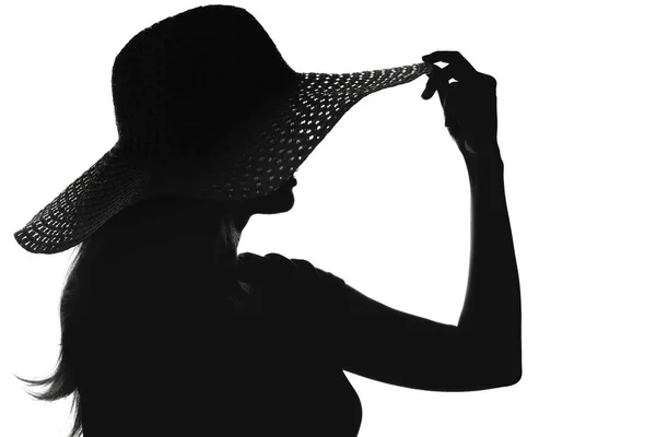 Silhouette di una donna con un cappello — Foto Stock