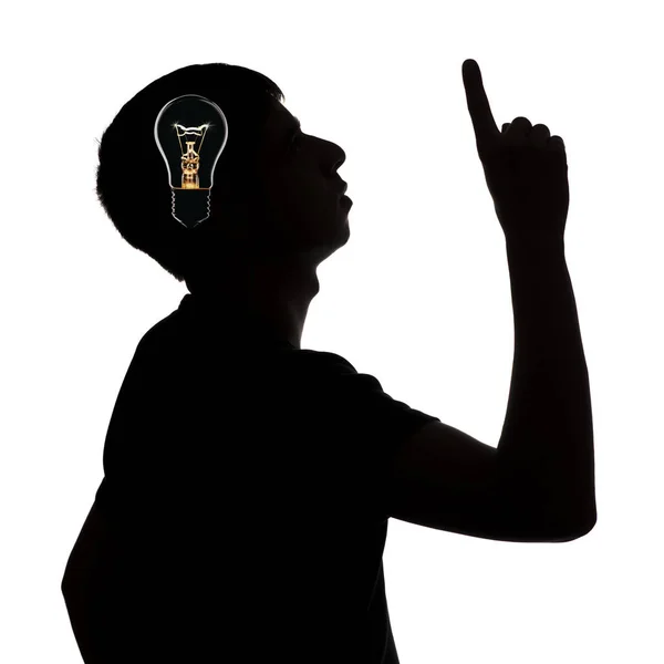 Silhouette of an unknown man who dawned on an idea on a white isolated background, concept thought light bulb — Stock Photo, Image