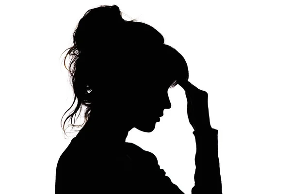 Silhouette einer nachdenklichen, traurigen Frau mit Hand vor der Stirn auf weißem, isoliertem Hintergrund, das Konzept Lebensprobleme und Depressionen — Stockfoto