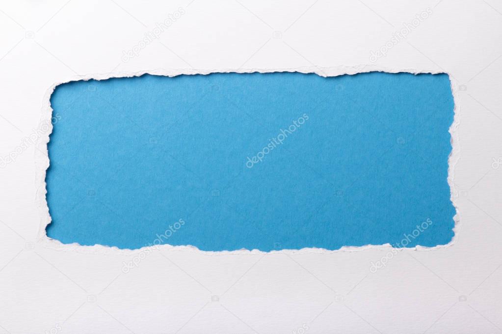 Ripped white paper with colored background with space for text