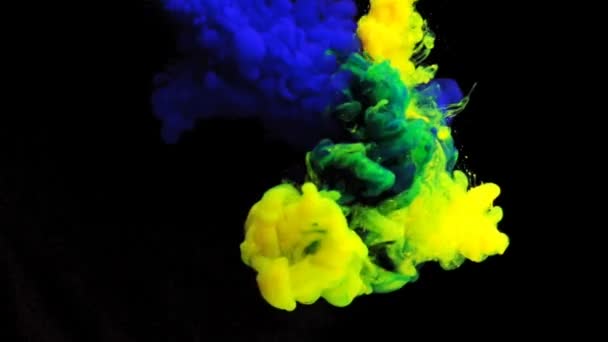 Paint in water on a black background. The ink in the water dissolves. A cloud of acrylic paint. With an alpha mask. — Stock Video