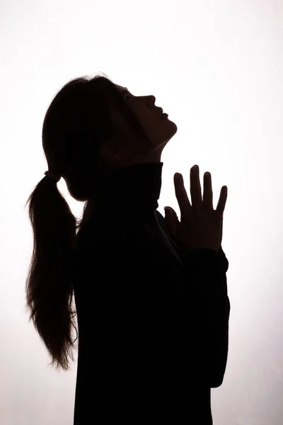 Silhouette Mädchen Hob Den Kopf Und Bat Hilfe Auf Weißem — Stockfoto