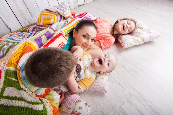 Happy Family Lie Floor Colorfull Blanket Laught Indoor Photo Shot — Stock Photo, Image