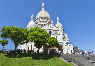 Walking at Montmartre on a sunny day clipart