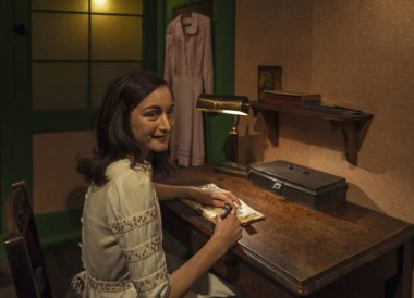 Berlin, Germany - March 2017: Anna Frank  wax figure in Madame Tussaud's museum clipart