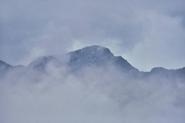 Mountain peaks in thick clouds at Grossglockner alpine road