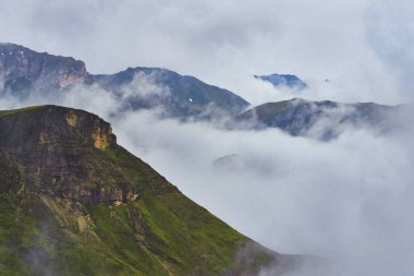 Mountain peaks in thick clouds at Grossglockner alpine road