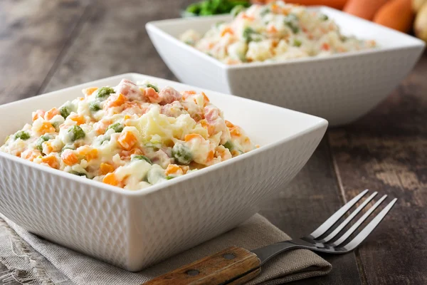 Russian salad and ingredients on rustic wooden — Φωτογραφία Αρχείου