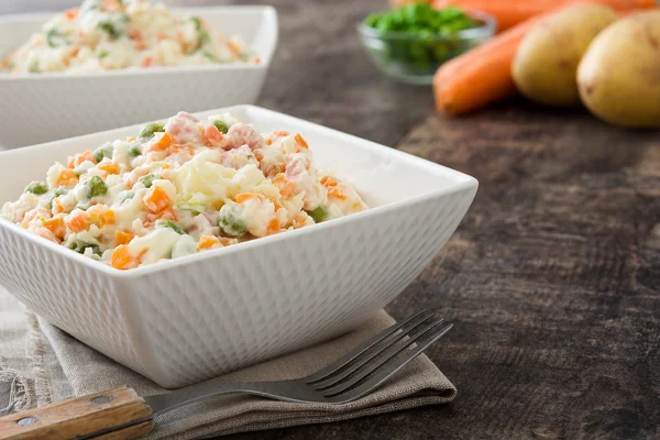 Russian salad and ingredients on rustic wooden — Φωτογραφία Αρχείου