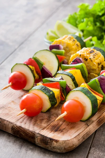 Vegetable skewers on wooden table